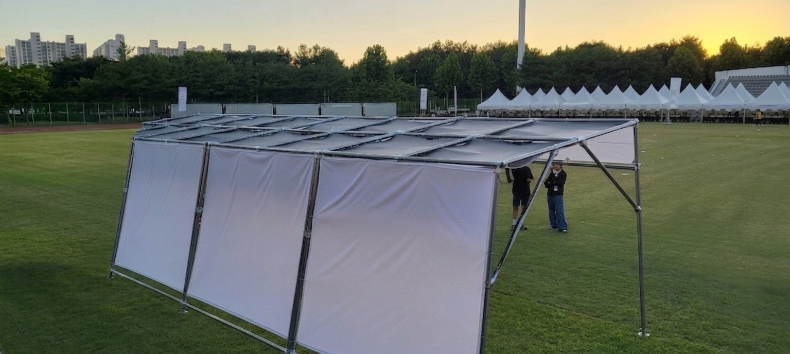 Full-size flexible solar canopy assembled on the field at the event venue